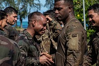 U.S. Army Hawaii Reserve soldiers from the 100th Battalion, 442nd Infantry Regiment, perform French combatives techniques on Camp Papeari Tahiti, French Polynesia, May 11, 2022. Marara 22 is a multinational training exercise which enhances combined interoperability between the U.S. military and France’s Combined Joint Task Force Headquarters in French Polynesia. The training advances partners’ abilities to address complex and future contingencies throughout the Indo-Pacific. This is the first iteration of Exercise Marara at the multinational level. (U.S. Army photo by Spc. Daniel Proper, 25th Infantry Division)
