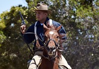 A Soldier assigned to the 11th Armored Cavalry Regiment Horse Detachment demonstrates his horseback riding skills during the Defense Language Institute Foreign Language Center's Language Day at the Presidio of Monterey, Calif., May 13.