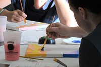 Fort Drum family members concentrate on their painting, while experiencing the therapeutic benefits of creative arts during the Family Advocacy Program’s “Paint More, Stress Less” workshop May 25 at the Main Post Chapel. 