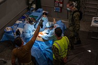 NEMTI’s Operation Firebreak Exercise Expands Level of Care 220620-N-IT566-0234CAMP PENDLETON, Calif. (June 20, 2022) Sailors assigned to Navy Reserve-Expeditionary Medical Facility (NR-EMF) Bethesda, perform surgery on a simulated patient while serving as the fleet surgical team as part of Operation Firebreak. Operation Firebreak involves patient care from point of injury through Role I, Role II, and Role III care. Operation Firebreak is part of EMF-Navy reserve Bethesda’s operational readiness evaluation (ORE). NR-EMF Bethesda is comprised of Reservists from around the country that came together to complete training which includes equipment familiarization, integrated medical and patient throughput training, medical scenarios, and emergency (fire, security, etc.) training. (U.S. Navy photo by Mass Communication Specialist 1st Class David Kolmel/ Released) www.dvidshub.net/news/423757/nemtis-operation-firebreak-e...