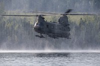 Army engineers and aircrew conduct helocast training at JBERAn Army CH-47F Chinook, operated by aircrew from B Company, 1-52nd General Support Aviation Battalion, passes over Clunie Lake during helocast training at Joint Base Elmendorf-Richardson, Alaska, June 29, 2022. Army combat engineers from Breacher Company, 6th Brigade Engineer Battalion (Airborne), 2nd Infantry Brigade Combat Team (Airborne), 11th Airborne Division, conducted the helocast operations to build confidence and familiarize themselves with future training they will encounter. (U.S. Air Force photo by Alejandro Peña)