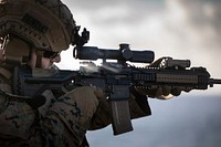 U.S. Marine Corps Lance Cpl. Jason Sewell, rifleman assigned to the 22nd Marine Expeditionary Unit (MEU), fires an M4 service rifle during a live-fire exercise aboard the Wasp-class amphibious assault ship USS Kearsarge (LHD 3), June 27, 2022. The Kearsarge Amphibious Ready Group and embarked 22nd MEU, under the command and control of Task Force 61/2, is on a scheduled deployment in the U.S. Naval Forces Europe area of operations, employed by U.S. Sixth Fleet, to defend U.S., allied and partner interests. (U.S. Navy photo by Mass Communication Specialist 3rd Class Gwyneth Vandevender)
