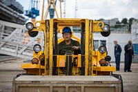 U.S. Marine Corps Lance Cpl. Duane Takala, a network administrator assigned to the 22nd Marine Expeditionary Unit, uses a forklift to maneuver a supply crate designated for the Wasp-class amphibious assault ship USS Kearsarge (LHD 3), during mid-deployment voyage repairs in Brest, France, June 30, 2022. The Kearsarge Amphibious Ready Group and embarked 22nd MEU, under the command and control of Task Force 61/2, is on a scheduled deployment in the U.S. Naval Forces Europe area of operations, employed by U.S. Sixth Fleet to defend U.S., allied and partner interests. (U.S. Navy photo by Mass Communication Specialist 3rd Class Jesse Schwab)