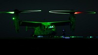 220714-N-TP544-1332 ATLANTIC OCEAN (July 14, 2022) A MV-22 Osprey, attached to the 22nd Marine Expeditionary Unit, idles on the flight deck of the Wasp-class amphibious assault ship USS Kearsarge (LHD 3) during night flight operations July 14, 2022. The Kearsarge Amphibious Ready Group and embarked 22nd Marine Expeditionary Unit, under the command and control of Task Force 61/2, is on a scheduled deployment in the U.S. Naval Forces Europe area of operations, employed by U.S. Sixth Fleet to defend U.S., allied and partner interests. (U.S. Navy photo by Mass Communication Specialist 3rd Class Taylor Parker)