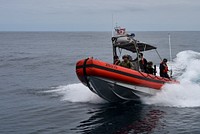 The Over the Horizon (OTH) cutter boat crew assigned to the Famous-class medium endurance cutter USCGC Mohawk (WMEC 913) conducts boat operations with personnel assigned to a Coast Guard Tactical Law Enforcement Team (TACLET) in the Atlantic Ocean, July 4, 2022. USCGC Mohawk is on a scheduled deployment in the U.S. Naval Forces Europe area of operations, employed by U.S. Sixth Fleet to defend U.S., allied, and partner interests. (U.S. Coast Guard photo by Petty Officer 3rd Class Jessica Fontenette)