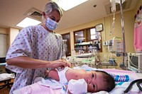 Pacific Partnership 2022 Medical Personnel Provide Pediatric Medical Care 220715-N-NC885-1014KOROR, Palau (July 15, 2022) – Lt. Cdr. Jamie Overbey, from Solana Beach, California, performs a pediatric exam on an infant at the Belau National Hospital in Palau during Pacific Partnership 2022. Now in its 17th year, Pacific Partnership is the largest annual multinational humanitarian assistance and disaster relief preparedness mission conducted in the Indo-Pacific. (U.S. Navy photo by Mass Communication Specialist 2nd Class Drace Wilson)