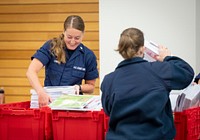 DHS and USCG Backpack DriveWashington, D.C. (August 17, 2022) U.S. Coast Guard and Department of Homeland Security personnel participate in a local back-to-school backpack drive, donating school supplies to children in the Washington D.C. area. (DHS Photo by Benjamin Applebaum)