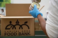 United States Department of Agriculture Assistant Secretary for Administration Oscar Gonzales and from Departmental Administration staff participate in a Feds Feed Families Volunteer Day at the Capital Area Food Bank in Washington, DC on Monday, September 19, 2022. The group worked a three-hour shift at the regional food bank and contributed towards packing 900 boxes of food to feed families in need. Each box the group packed will feed a family of four for three days. USDA photo by Tom Witham.. 