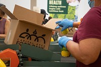 United States Department of Agriculture Assistant Secretary for Administration Oscar Gonzales and from Departmental Administration staff participate in a Feds Feed Families Volunteer Day at the Capital Area Food Bank in Washington, DC on Monday, September 19, 2022. The group worked a three-hour shift at the regional food bank and contributed towards packing 900 boxes of food to feed families in need. Each box the group packed will feed a family of four for three days. USDA photo by Tom Witham.. 