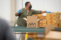 United States Department of Agriculture Assistant Secretary for Administration Oscar Gonzales and from Departmental Administration staff participate in a Feds Feed Families Volunteer Day at the Capital Area Food Bank in Washington, DC on Monday, September 19, 2022. The group worked a three-hour shift at the regional food bank and contributed towards packing 900 boxes of food to feed families in need. Each box the group packed will feed a family of four for three days. USDA photo by Tom Witham.. 