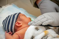 NMCP'S NEW BABY CLINIC 220924-N-AO813-1011Senior Airman Anika Davis-Olson, assigned to Internal Medicine at Air Force Medical Service (AFMS) 633 Medical Group (MDG) in Langley, Va., gets vitals from newborn Esiais Leio Almaraz during a 48 hour well baby check at Naval Medical Center Portsmouth's (NMCP) new baby clinic. Davis-Olson was at NMCP as part of support from the McDonald Army Health Center at Fort Eustis Va. and AFMS Langley 633 MDG at Joint Base Langley-Eustis, Hampton, Va. -- both Defense Health Agency (DHA) Market Partners in the Tidewater area. Their support enables Portsmouth's New Baby Clinic to remain open on Saturdays during the deployment of the USNS Comfort (T-AH-20). Together the DHA Tidewater Market continues to provide safe and quality care for its Service Members across all the area MTFs. #DHATIDEWATERMARKETPARTNERS