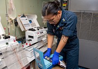 Sailors prepare blood samples for surgeries aboard USNS Mercy 220829-N-HI500-1003HONIARA, Solomon Islands (Aug. 29, 2022) – Hospital Corpsman 1st Class Kendal Swenson, from Vancouver, Washington, prepares blood products for transfusions ahead of scheduled surgeries aboard Military Sealift Command hospital ship USNS Mercy (T-AH 19) during Pacific Partnership 2022. Now in its 17th year, Pacific Partnership is the largest annual multinational humanitarian assistance and disaster relief preparedness mission conducted in the Indo-Pacific. Pacific Partnership is a unifying mission that fosters enduring friendships and cooperation among many nations. The year’s mission in Solomon Islands will include participants from the United States, Japan and Australia. (U.S. Navy photo by Mass Communication Specialist 2nd Class Brandie Nuzzi)