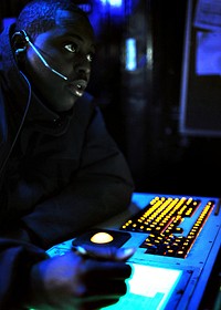 U.S. Navy Air-Traffic Controller 1st Class Marcus Smalley coordinates the recovery of aircraft on a marshal positioning System while the aircraft carrier USS Enterprise (CVN 65) conducts flight operations in the Mediterranean Sea Feb. 12, 2011.