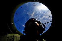 U.S. Air Force Staff Sgt. Stewart Guethlein looks for simulated enemy forces during exercise Cope North, Feb. 23, 2011.