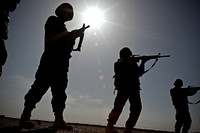 Afghan National Army (ANA) soldiers rehearse sighting in on their targets from the standing position while learning proper firing positions as part of a Basic Marksmanship Course, March 12, 2011, at the ANA Academy at Forward Operating Base Geronimo, Afghanistan.