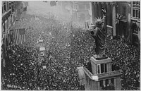 The announcing of the armistice on November 11, 1918, was the occasion for a monster celebration in Philadelphia, Pennsylvania. Thousands massed on all sides of the replica of the Statue of Liberty on Broad Street, and cheered unceasingly. Philadelphia Pu. Original public domain image from Flickr