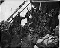 The Famous 369th Arrive in New York City. Members of the 369th [African American] Infantry, formerly 15th New York Regulars. Back to little old New York, 1917 - ca. 1919. Original public domain image from Flickr