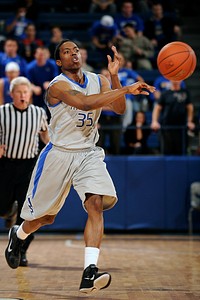 Senior Evan Washington passes during the Falcons final home game of the season at the U.S. Air Force Academy's Clune Arena in Colorado Springs, Colo. March 2, 2011.