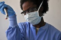 Lilongwe, Malawi - Staff Sgt. Amy L. Montgomery, of the 908th Aeromedical Staging Squadron, and from Columbus, Ga., shows the recently extracted tooth of a Malawian citizen pulled by Air Force Reserve dentist. Original public domain image from Flickr