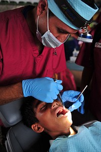 110704-F-NJ219-012 - PUERTO SAN JOSE, Guatemala - (July 4, 2011) 1st Lt. Carlos Salinas, a dentist from Asuncion, Paraguay, numbs a patient's gums prior to a tooth extraction at the Aldea Las Morenas Iztapa in Puerto San Jose, Guatemala during Continuing Promise 2011 (CP11).