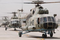 Afghan National Army Mi-17 helicopters taxi on the runway of the Kabul International Airport in Kabul, Afghanistan, Aug. 10, 2011, after returning from a counter-narcotics operation in the Nangarhar province.