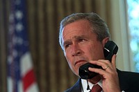 Pledging his support, President George W. Bush talks via telephone to New York Governor George Pataki and New York City Mayor Rudolph Giuliani, 09/13/2001. Original public domain image from Flickr