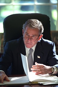 911: President George W. Bush in Oval Office, 10/29/2001. Original public domain image from Flickr