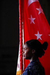 U.S. Navy Ship’s Serviceman Seaman Kimberly Fleming trains with the color guard aboard the aircraft carrier USS George Washington (CVN 73) before pulling into Singapore in the South China Sea, Oct. 12, 2011.