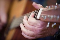 Playing guitar, music performance. Original public domain image from Flickr