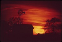 Seward County farm and windmill at sunset, May 1973. Photographer: O'Rear, Charles. Original public domain image from Flickr