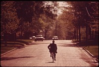 Associate County Court Judge Fred Burns, on his daily bike ride to the Seaward County courthouse, May 1973. Photographer: O'Rear, Charles. Original public domain image from Flickr