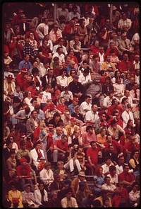 The annual spring football game at the University of Nebraska is a stadium-packing event. It is an intra-squad game, and many fans wear red in tribute to the team, nicknamed the "Big Red," May 1973. Photographer: O'Rear, Charles. Original public domain image from Flickr