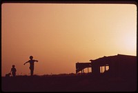 Farm youngsters playing at sunset near their home in Ripley, May 1972. Photographer: O'Rear, Charles. Original public domain image from Flickr