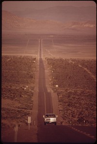 EPA laboratory monitor, frank reed, driving agency truck makes daily collections of water and air samples from atomic test site area, May 1972. Photographer: O'Rear, Charles. Original public domain image from Flickr