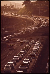 Morning rush hour traffic on H-1 freeway approaching Honolulu from the west. Commuters come from such fast growing areas as Pearl City and Mililani town, October 1973. Photographer: O'Rear, Charles. Original public domain image from Flickr