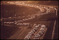 Morning rush hour traffic on H-1 freeway approaching Honolulu from the west. Commuters come from such fast growing areas as Pearl City and Mililani town, October 1973. Photographer: O'Rear, Charles. Original public domain image from Flickr
