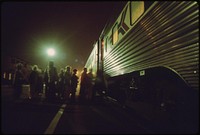 Amtrak passengers board the southbound san diegan as it makes a nighttime stop at the Fullerton, California, station, May 1974. Photographer: O'Rear, Charles. Original public domain image from Flickr