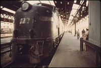 Loading platform at Union Station in Kansas City, Missouri The old engine pulled a train from New York which will connect with the Southwest Limited which runs between Chicago and Los Angeles, June 1974. Photographer: O'Rear, Charles. Original public domain image from Flickr