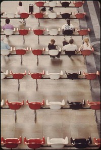 Modern seating arrangement contrasts with the older stone flooring in Union Station at Kansas City, Missouri, June 1974. Photographer: O'Rear, Charles. Original public domain image from Flickr