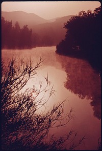 Sunrise on Malibu Lake in the Santa Monica Mountains near Malibu, California, which is located on the northwestern edge of Los Angeles County, May 1975. Photographer: O'Rear, Charles. Original public domain image from Flickr