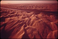 The All-American Canal carries Colorado River water through the sand dunes of the western part of the Imperial Valley, May 1972. Photographer: O'Rear, Charles. Original public domain image from Flickr