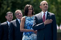 From right, President Barack Obama, first lady Michelle Obama, Secretary of Defense Leon E. Panetta and Veterans Administration Secretary Eric Shinseki render honors at a ceremony commemorating the 50th anniversary of the Vietnam War at the Vietnam Veterans Memorial in Washington, D.C., May 28, 2012.