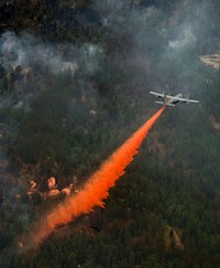 Personnel with the 153rd Airlift Wing based in Cheyenne, Wyo., use a modular airborne firefighting system (MAFFS)-equipped C-130 Hercules aircraft to fight the Waldo Canyon wildfire in Colorado Springs, Colo., June 28, 2012.