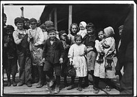 All these children except babies shuck oysters and tend babies at the Pass Packing Co., February 1911. Photographer: Hine, Lewis. Original public domain image from Flickr