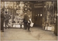 Photograph of Earle Frere, a young truant selling extra during school hours Monday on Pennsylvania Avenue, April 1912. Photographer: Hine, Lewis. Original public domain image from Flickr