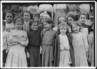 These all work in Cleveland Hosiery Mills. The very youngest one (with curls) said, "I ravels and picks up", December 1910. Photographer: Hine, Lewis. Original public domain image from Flickr