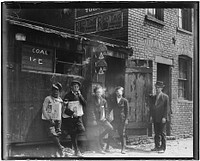 11:00 A.M. Newsies at Skeeter's Branch. They were all smoking. St. Louis, Mo, May 1910. Photographer: Hine, Lewis. Original public domain image from Flickr