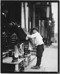 Michael Mero, Bootblack, 12 years of age, working one year of own volution. Don't smoke. Out after 11 P.M. on May 21. Ordinarily works 6 hours per day, May 1910. Photographer: Hine, Lewis. Original public domain image from Flickr