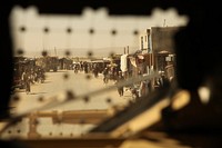 U.S. Soldiers with the 1st Squadron, 4th Cavalry Regiment, 4th Infantry Brigade Combat Team, 1st Infantry Division drive through Mata Khan village in Paktika province, Afghanistan, Oct. 2, 2012, as residents walk the streets.