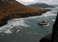 Two life rafts sit on the beach adjacent to Royal Dutch Shell's conical drilling unit Kulluk, 40 miles southwest of Kodiak City, Alaska, Jan. 3, 2013.
